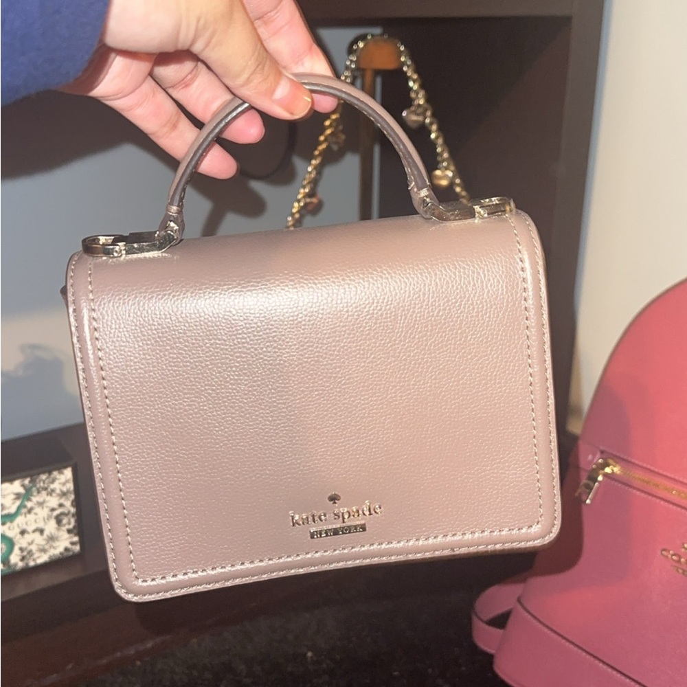 Kate Spade purplish-pinkish shoulder/crossbody bag. Included its OG long strap.